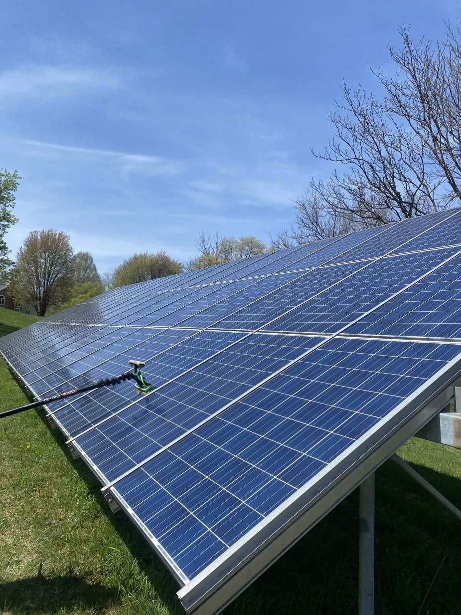Clean residential solar panels on a bright sunlit rooftop